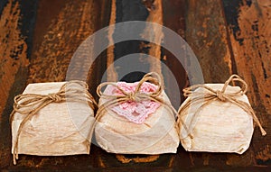 Three Brazilian wedding sweets bem casado with crochet pink hear photo