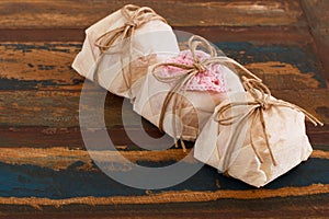 Three Brazilian wedding sweets bem casado with pink crochet hear