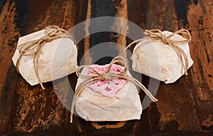 Three Brazilian wedding sweets bem casado on wooden table photo