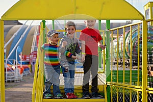 Three brothers in an amusement park