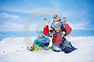 Three brothers having fun on winter day