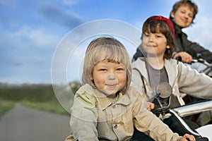 Three brothers ride bikes