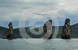 Three Brothers Rocks in the Avacha Bay of Pacific Ocean. Coast of Kamchatka.