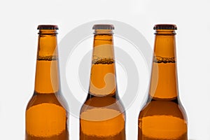 Three brown beer bottles