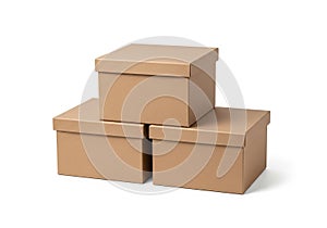 Stack of three brown cardboard boxes on white background