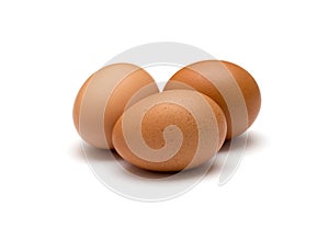 Three brown eggs