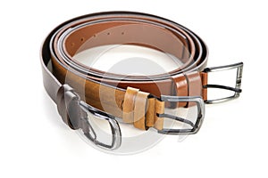 A three brown leather belt isolated over white background