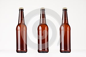 Three brown longneck beer bottles mock up.