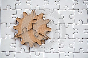 Three brown pieces of puzzle on a white jigsaw background, last piece of jigsaw puzzle to complete the mission, Business solutions