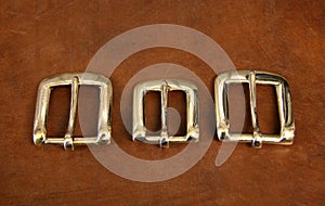 Three buckles on leather