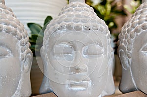 Three Buddha heads