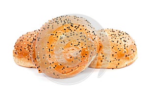 Three burger buns with sesame seeds on white background