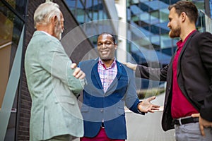 Three business men talking.