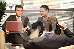 Three Business men working in the office