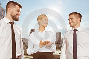 Three business partners having conversation