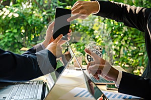 Three business people discuss the business affair on mobile phone. Communication technology concept