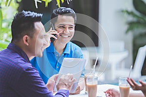 Three Business people meeting in cafe