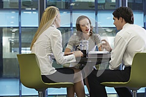 Three Businesspeople During Coffee Break