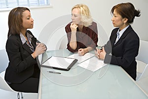 Three businesswomen at desk