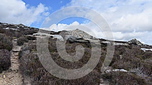 Three cairns on sloping hillside