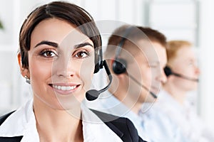 Three call center service operators at work