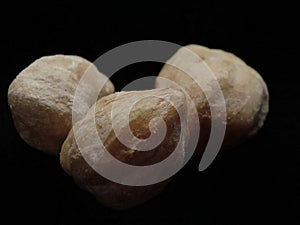 three candlenut, isolated on black