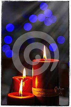 Three candles in bokeh background