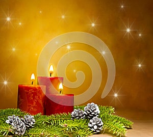 Three candles in a festive Christmas setting photo