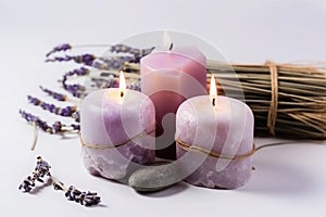 Three candles with lavender candles in front of a stone and lavender flowers. AI generation