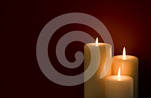 Three Candles Red Background