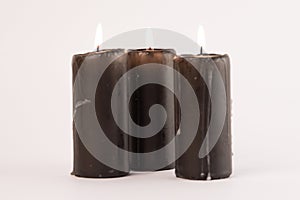 Three candles on a white background.