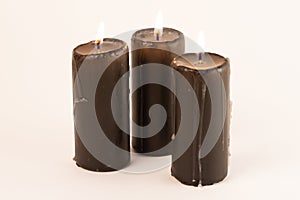 Three candles on a white background