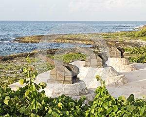 Three canon sculptures on the shore of Fatima Bay