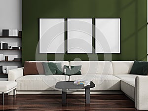 Three canvases on green wall in living room