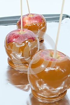 Three caramel apples