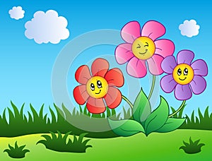 Three cartoon flowers on meadow