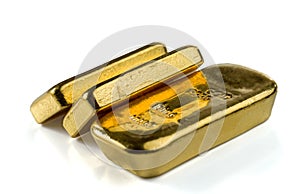 Three cast gold bars, the typical form of bullion gold bullion.