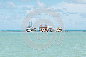 Three Catamaran boats in the middle of sea photo