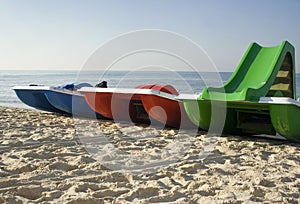 Three catamarans on the beach