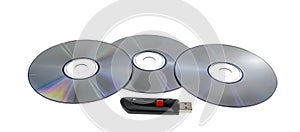 Three CDs and High Capacity USB Flash Drive On White