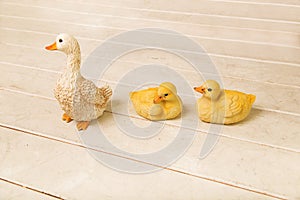 Three ceramic duck figurines