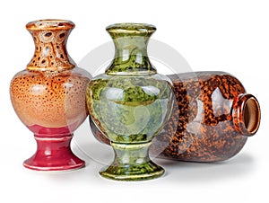 Three ceramic vases one lying