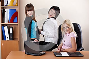 Three charming females at office