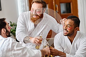 Three cheerful men in bathrobes enjoying