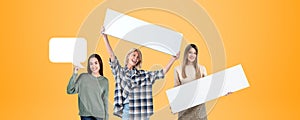 Three cheerful women holding blank signs and speech bubble