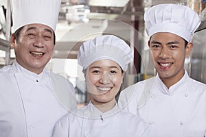 Three Chefs in an Industrial Kitchen