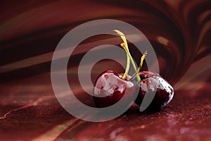 Three cherries on red background