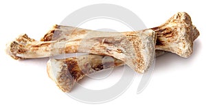 Three chicken bones are isolated on a white background
