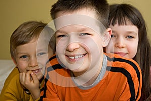 Three Children with Beaming Smiles photo