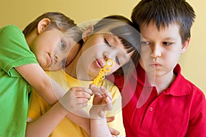 Three Children Blow Bubbles